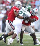 Marcus Freeman, left, and Malcolm Jenkins team up to stop Javon Ringer, who was limited to 49 yards on 18 carries.