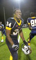 Naples full back Carlos Hyde celebrates the Golden Eagles victory in the Class 3A regional semifinal at Staver Field on Friday, Nov. 28, 2008, in Naples. Naples defeated Dunbar, 17,-14. David Albers/ Staff