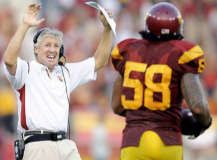 USC Coach Pete Carroll is all smiles after Rey Maualuga (58) came up with a 48-yard interception return for a touchdown in the second quarter Saturday. (Wally Skalij / Los Angeles Times)