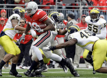 Ohio State running back Chris Wells (28) breaks away from Michigan defense for a touchdown run during the first quarter of an NCAA college football game Saturday, Nov. 22, 2008 in Columbus, Ohio. (AP Photo/Charles Rex Arbogast)