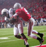 Penn State's Lydell Sargeant (10) intercepts a pass intended for Ohio State's Brian Hartline, sealing the Nittany Lions victory in the final minute Saturday night.