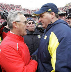 
Ohio State head coach Jim Tressel, left, shakes hands with Michigan head coach Rich Rodriguez after an NCAA college football game Saturday, Nov. 22, 2008 in Columbus, Ohio. Ohio State beat Michigan, 42-7. (AP Photo/Charles Rex Arbogast)