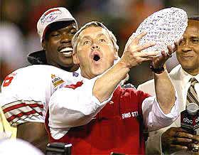 Ohio State's Jim Tressel with national championship trophy after winning the BCS Title Game against the Miami Hurricanes in the 2003 Fiesta Bowl in Tempe Arizona